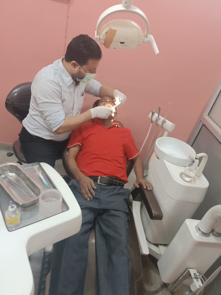 Dr. Shahbaz Alam treating a patient at Alam Dental Care & Implant Center in Jamshedpur